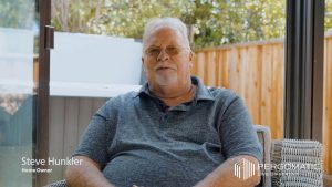 Homeowner Steve Hunkler discusses his Pergomatic pergola while relaxing under the covered patio.